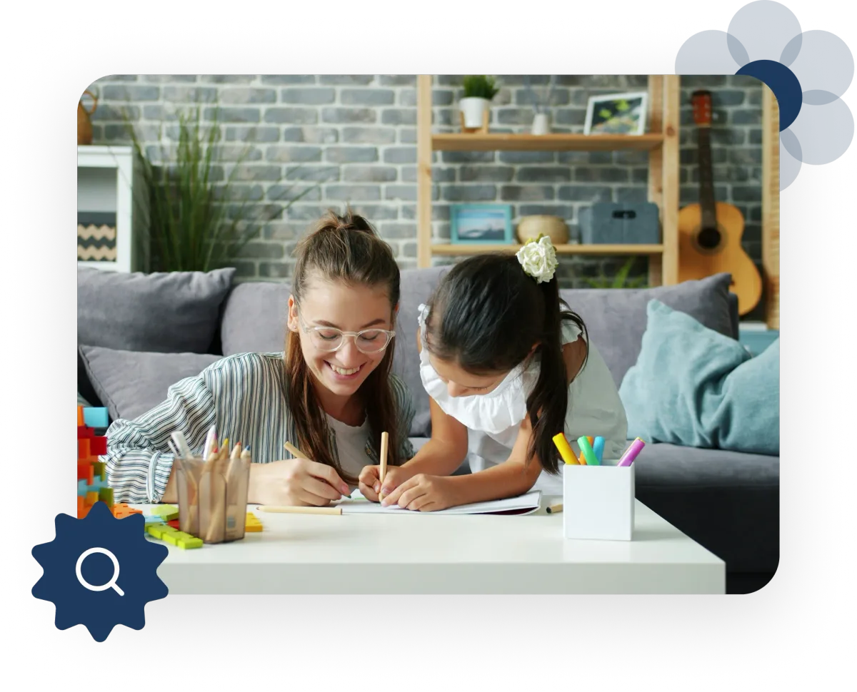 mother drawing with child on table